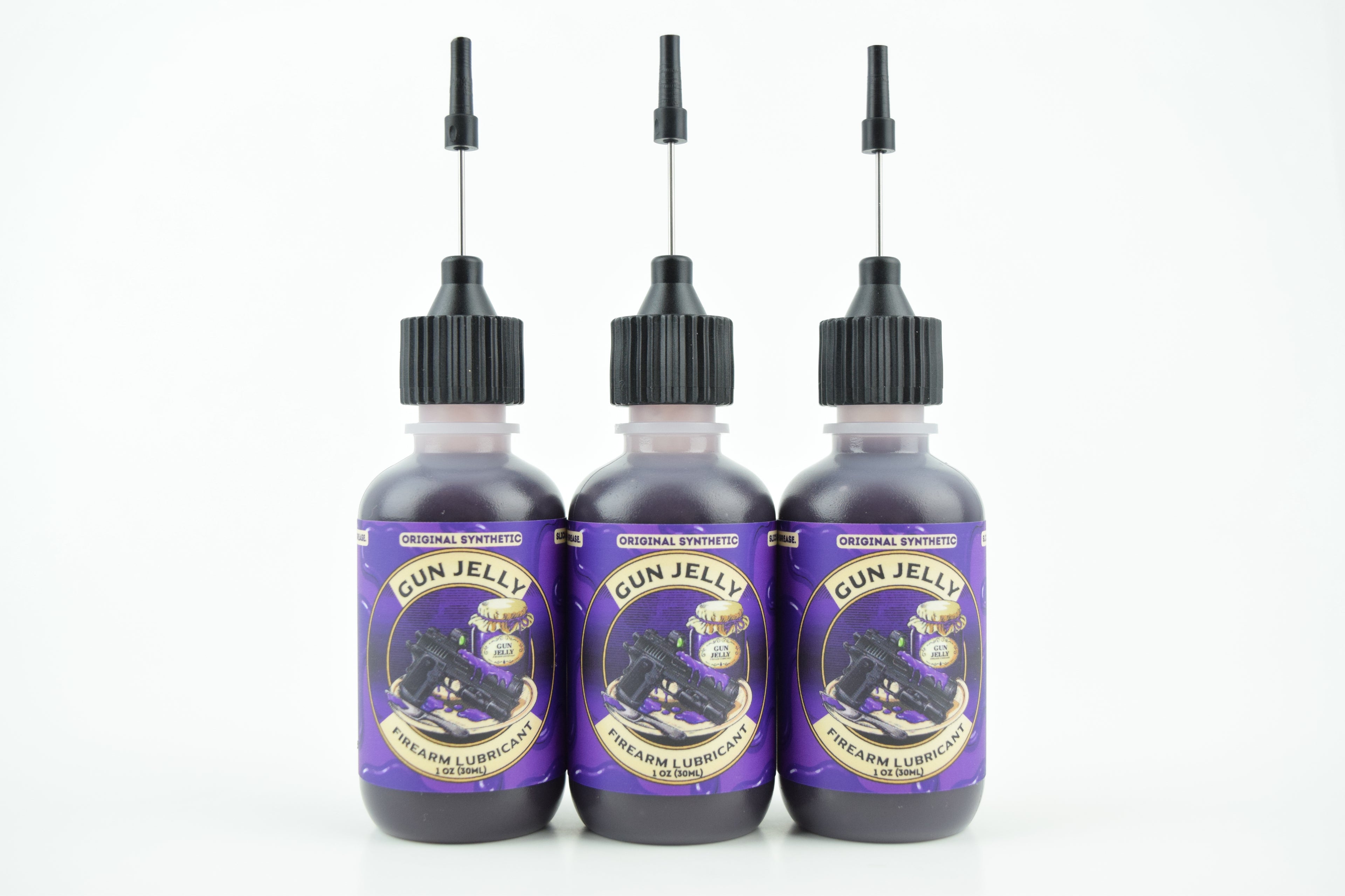 Three bottles of Gun Jelly with purple labels and black applicator caps, arranged side by side on a white background.
